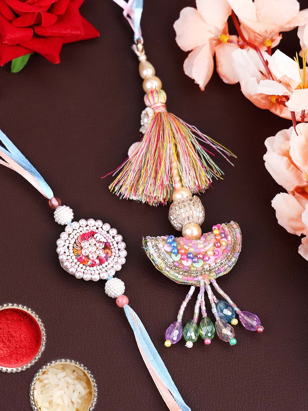 

PANASH Gold Plated Set of 2 Multi Color Bhaiya Bhabhi Rakhis & Roli Chawal