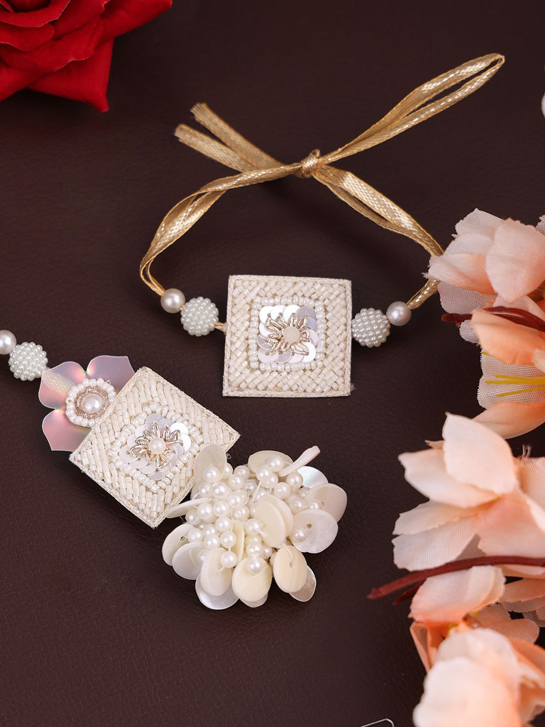 

PANASH- Gold Plated Set Of 2 Floral Shaped Bhaiya Bhabhi Rakhis With Roli Chawal