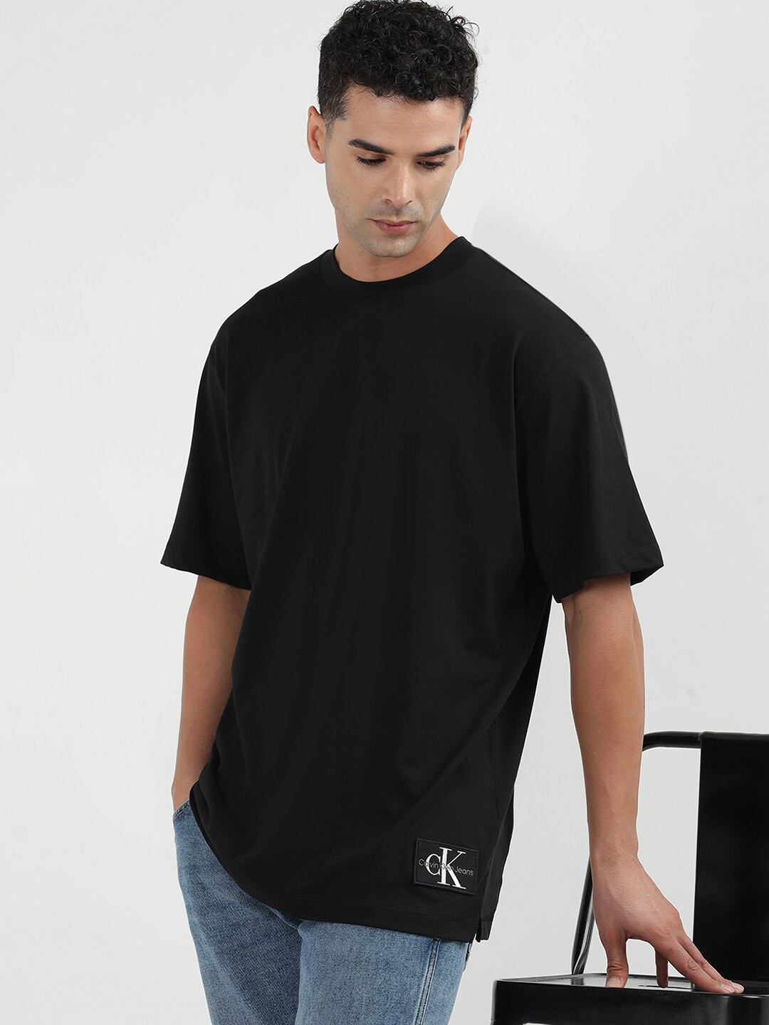 

Calvin Klein Jeans Men Solid Round Neck Applique T-shirt, Black