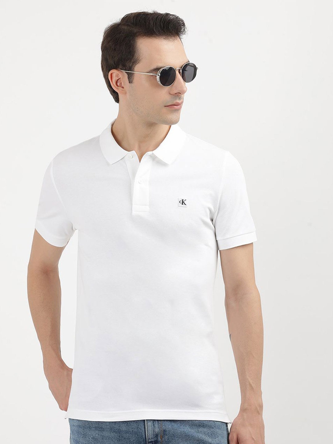 

Calvin Klein Jeans Men Solid Polo Collar Solid T-shirt, White