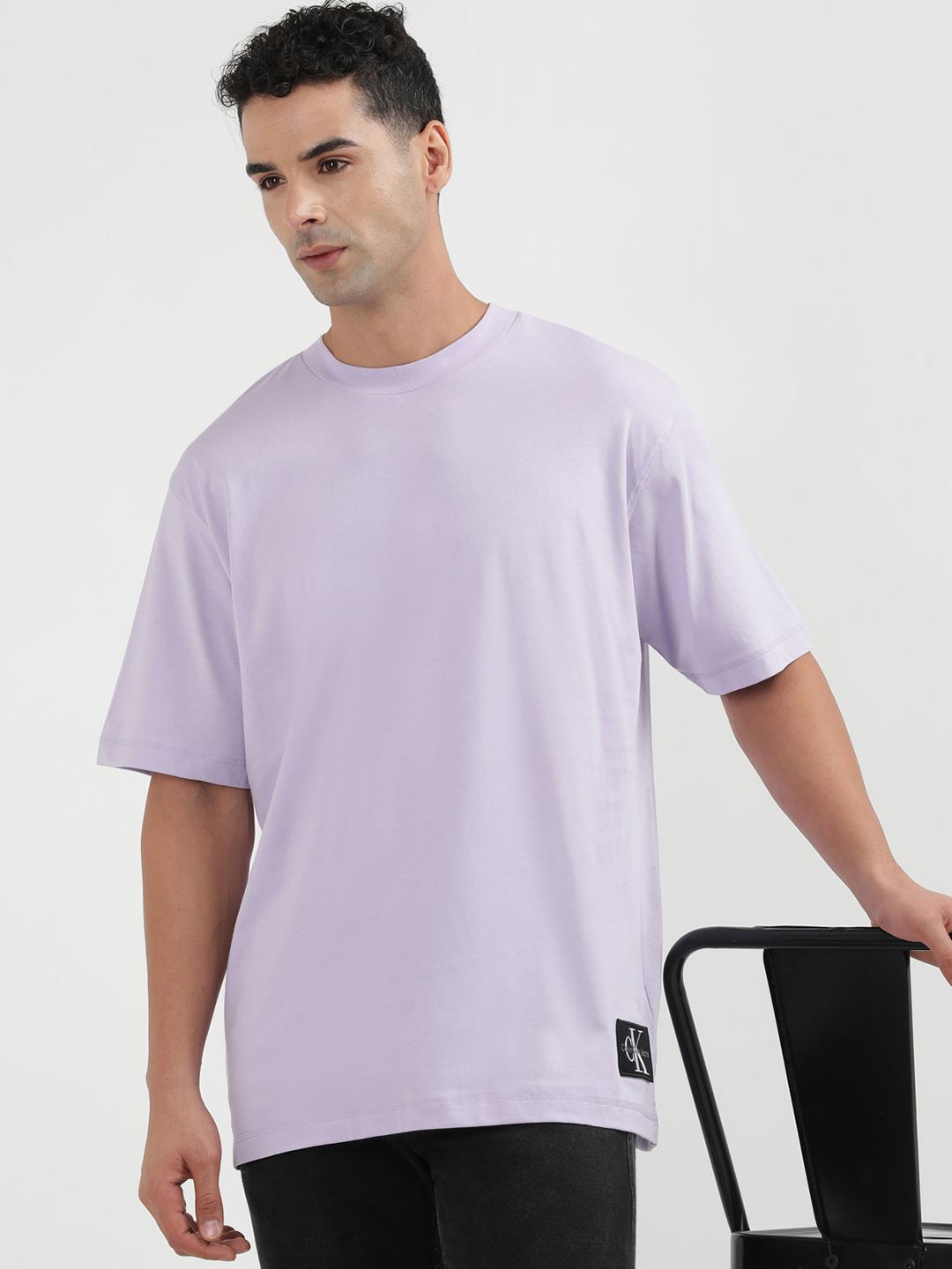 

Calvin Klein Jeans Men Solid Round Neck Applique T-shirt, Purple