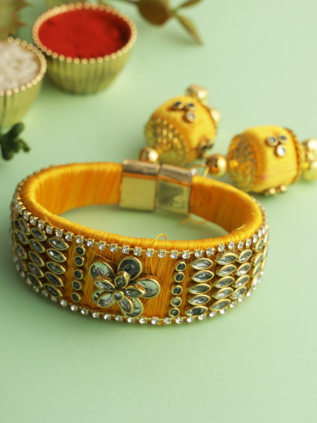 

Aapno Rajasthan Kundan Bangle Rakhi With Roli Chawal & Greetings Card, Gold