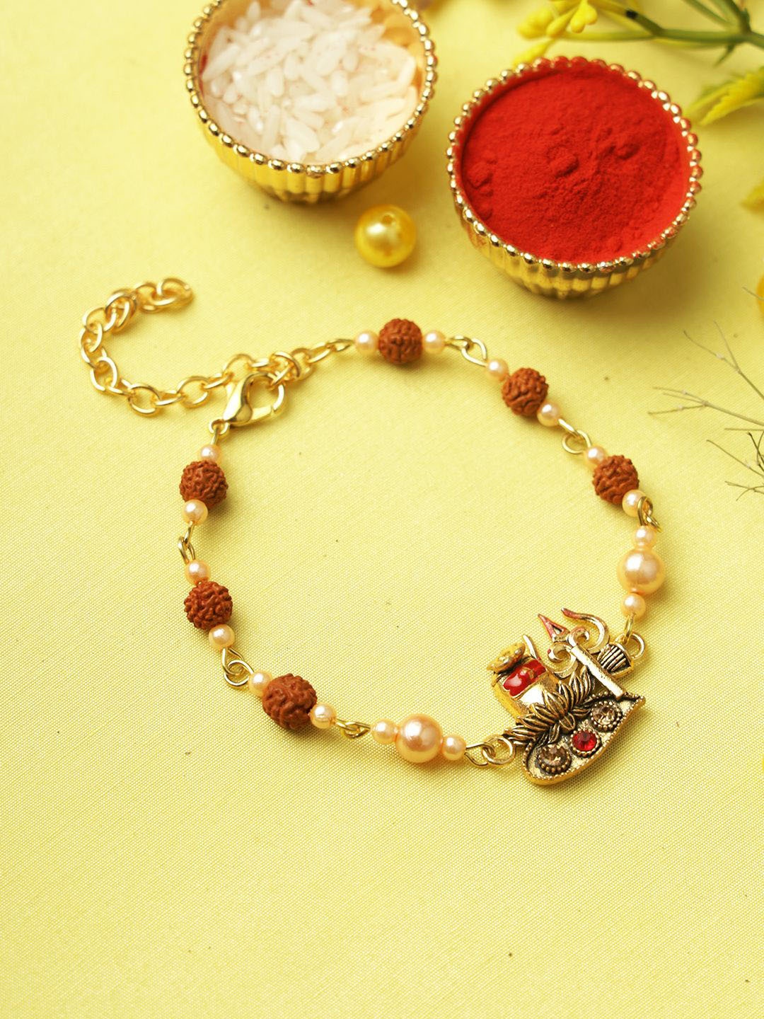 

Aapno Rajasthan Shivaling Rudraksh Rakhi With Roli Chawal & Greetings Card, Brown