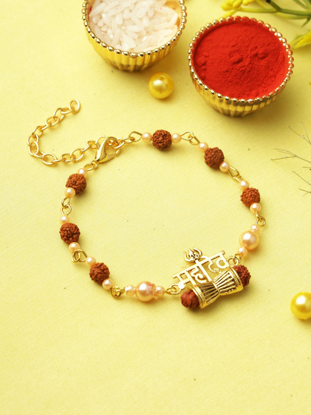 

Aapno Rajasthan Mahadev Shiva Damroo Rudraksh Rakhi With Roli Chawal & Greetings Card, Gold