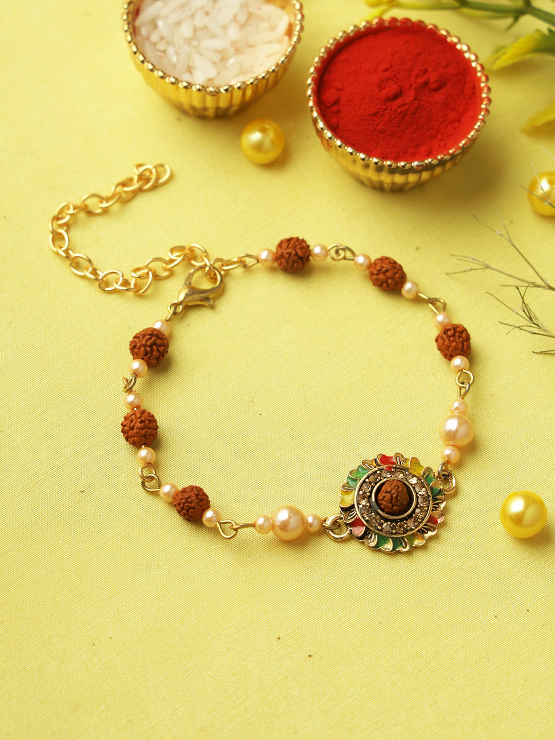

Aapno Rajasthan Rudraksh Bracelet Rakhi With Roli Chawal & Greetings Card, Gold