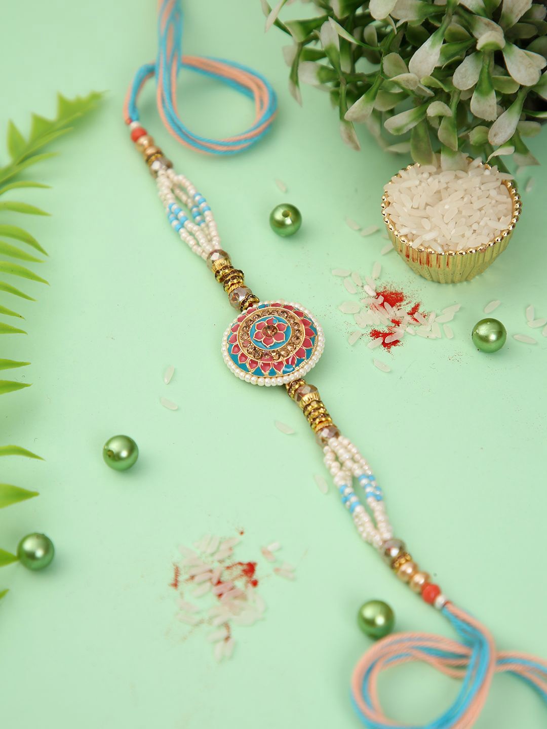 

Aapno Rajasthan Floral Pearl-Beaded Rakhi with Roli Chawal & Greeting Card, Gold