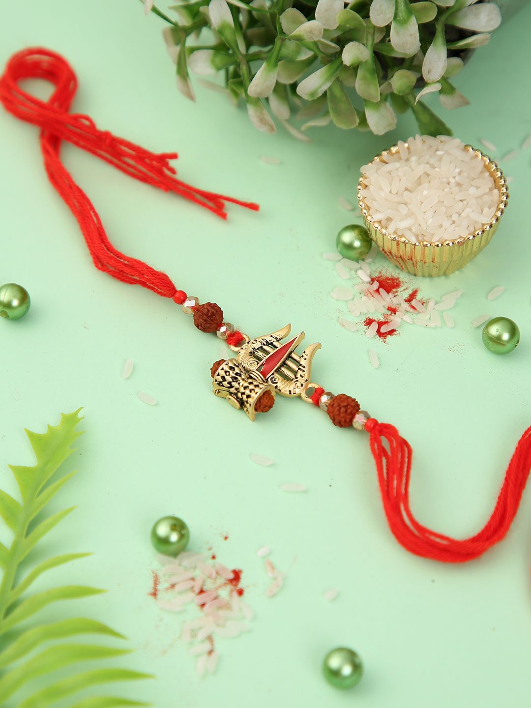 

Aapno Rajasthan Trishul Rudraksh Rakhi With Roli Chawal & Greetings Card, Red