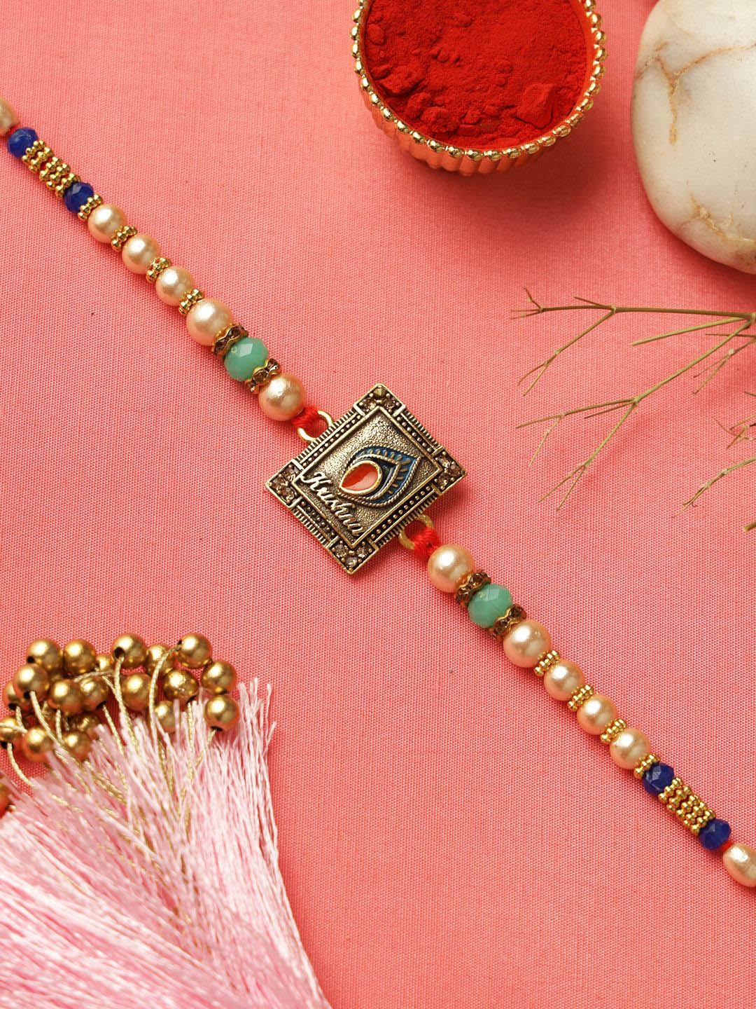 

Aapno Rajasthan Krishna Charm Rakhi With Roli Chawal & Greetings Card, Cream