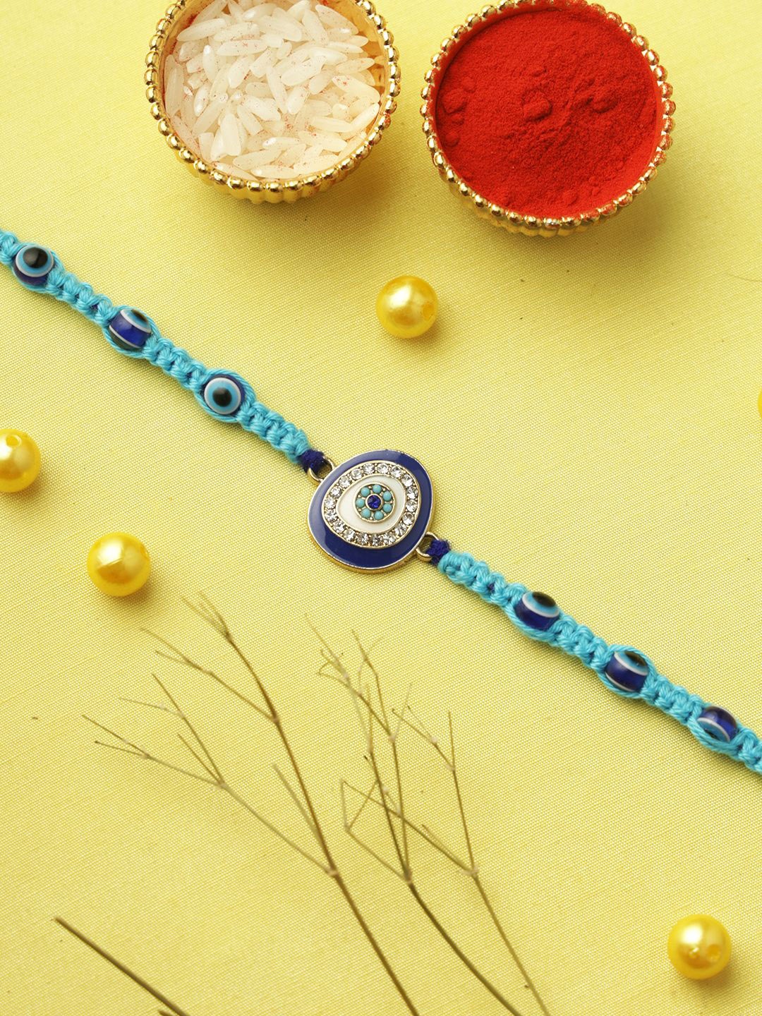 

Aapno Rajasthan Evil Eye Protection Studded Rakhi with Roli Chawal & Greeting Card, Gold