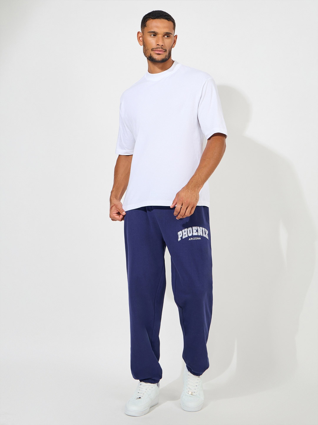 

Styli Men Embroidered City Name Relaxed Terry Joggers, Navy blue