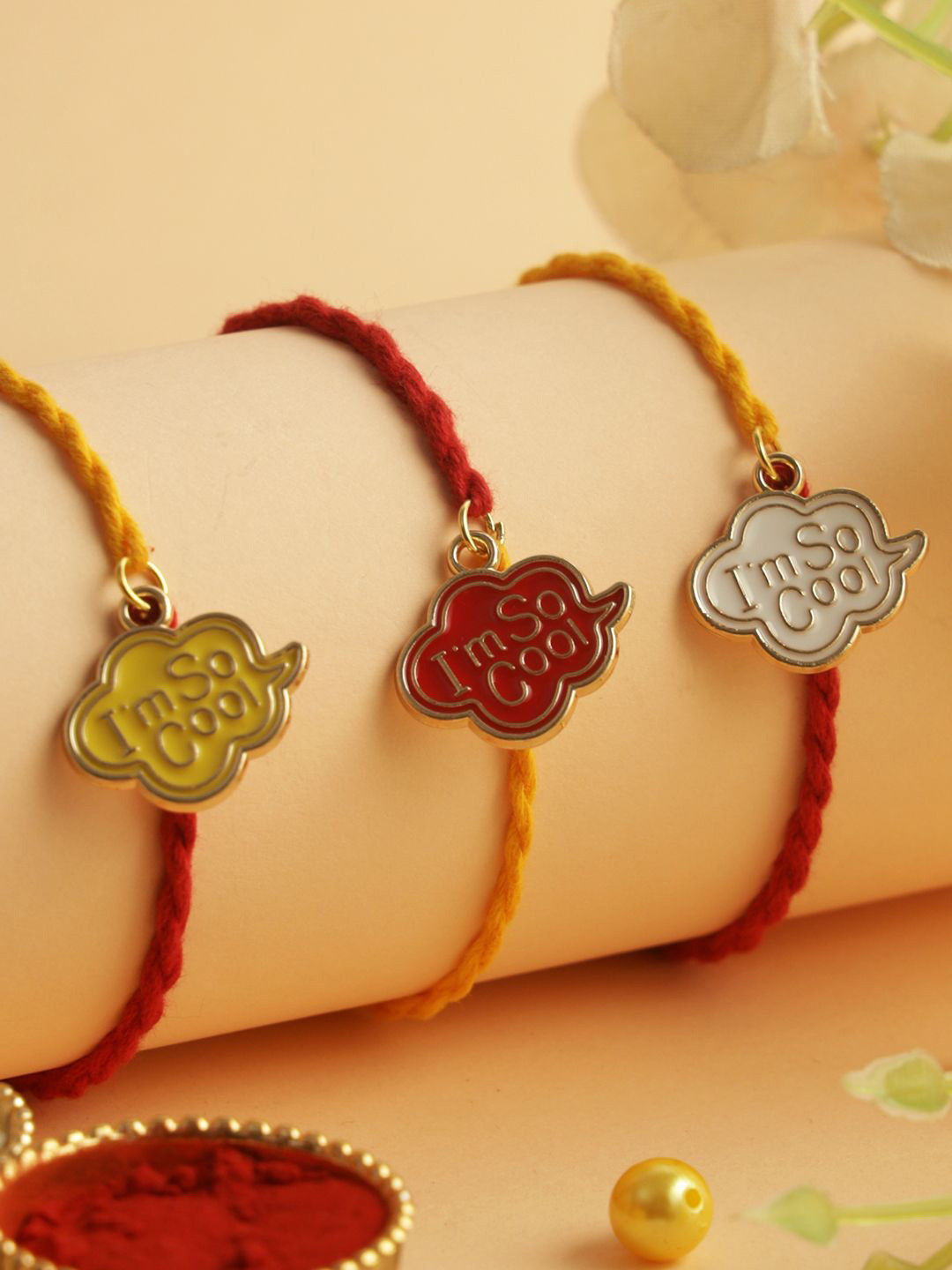 

Aapno Rajasthan Set of 3 Enameled Rakhi with Roli Chawal & Greeting Card, Red