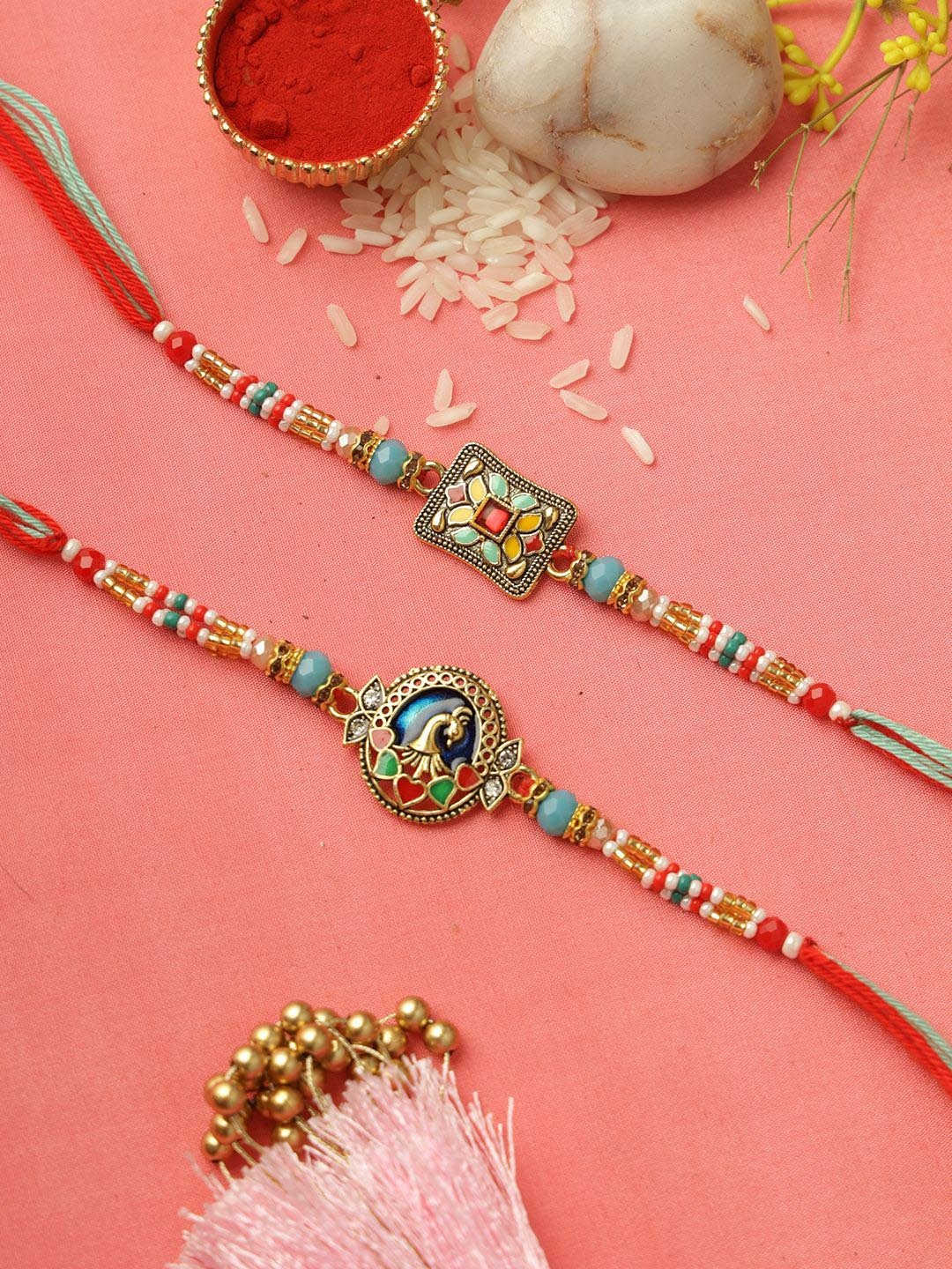 

Aapno Rajasthan Set of 2 Peacock Beaded Rakhi with Roli Chawal & Greeting Card, Gold