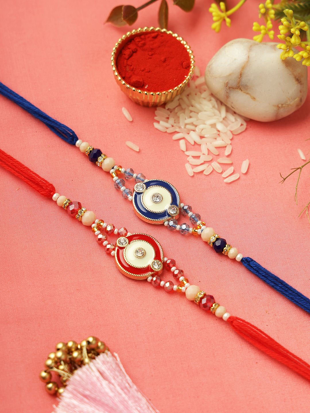 

Aapno Rajasthan Set Of 2 Stone Studded & Beaded Rakhis With Roli Chawal & Greetings Card, Red