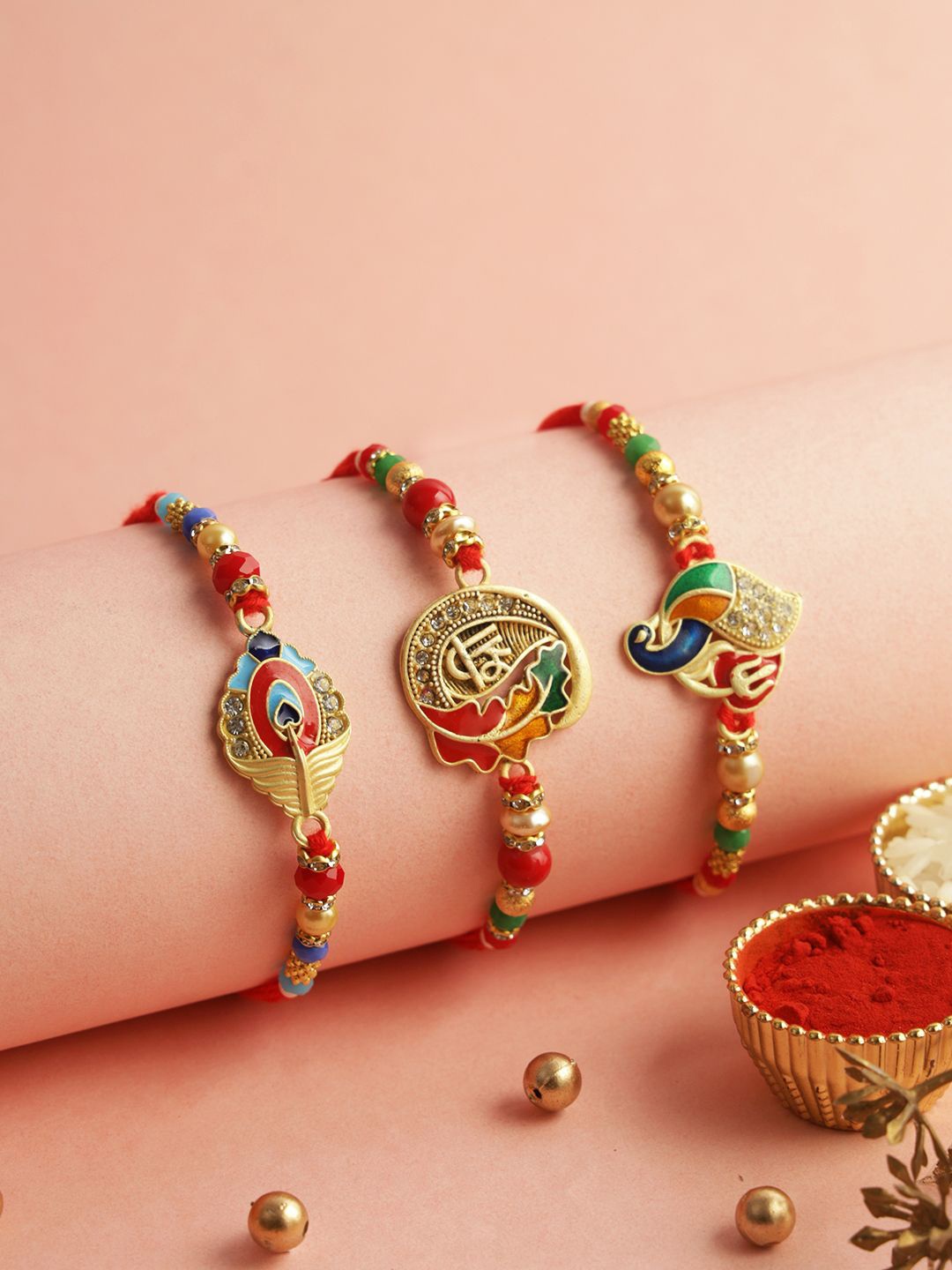 

Aapno Rajasthan Set Of 3 Stone Studded & Beaded Rakhis With Roli Chawal & Greetings Card, Red