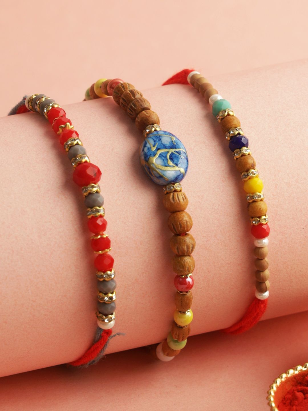 

Aapno Rajasthan Set of 3 Beaded Rakhi with Roli Chawal & Greeting Card, Red