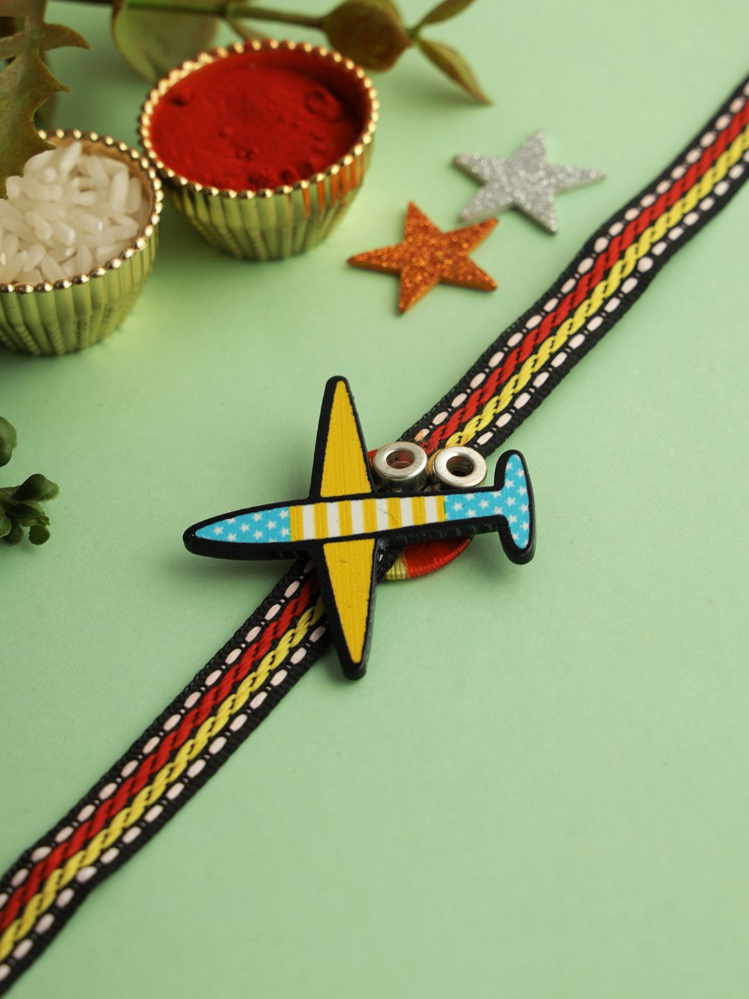 

Aapno Rajasthan Aeroplane Rakhi With Roli Chawal & Greetings Card, Yellow