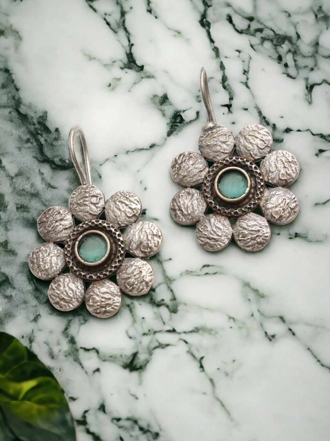 

Ozanoo Silver-Plated Stones Studded Floral Stud Earrings