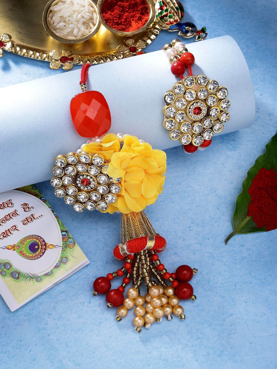 

NVR Set of 2 Stone Studded & Beaded Thread Rakhi With Roli Chawal, Yellow