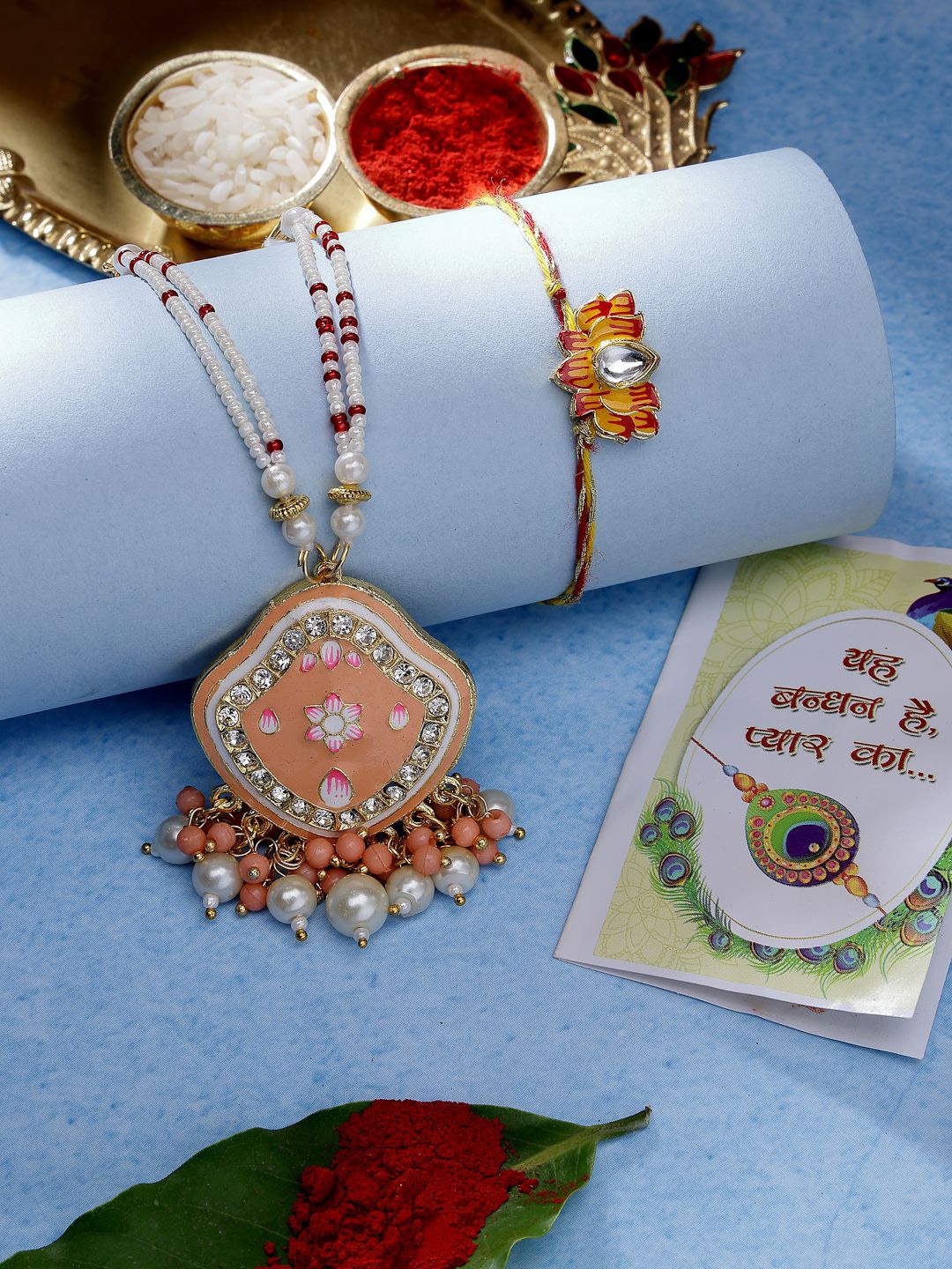 

NVR Set of 2 Peach Kundan Stone-Studded & Beaded Bhaiya Bhabhi Rakhis With Roli Chawal