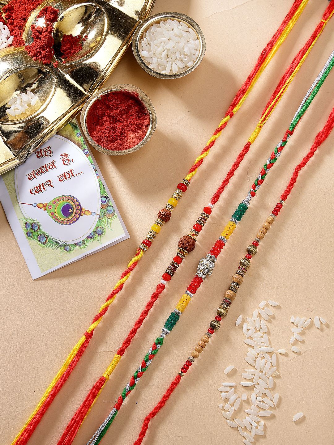 

NVR Unisex Set Of 4 Stones Studded & Beaded Thread Rakhis With Roli Chawal, Red