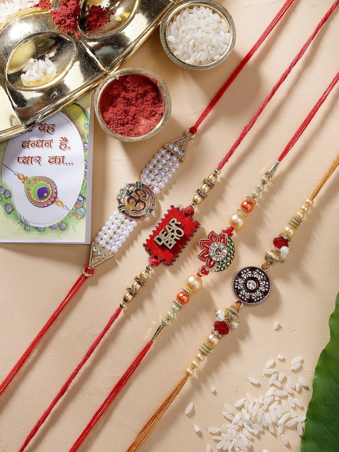 

NVR Set of 4 Stone-Studded & Beaded Thread Rakhis With Roli Chawal, Red