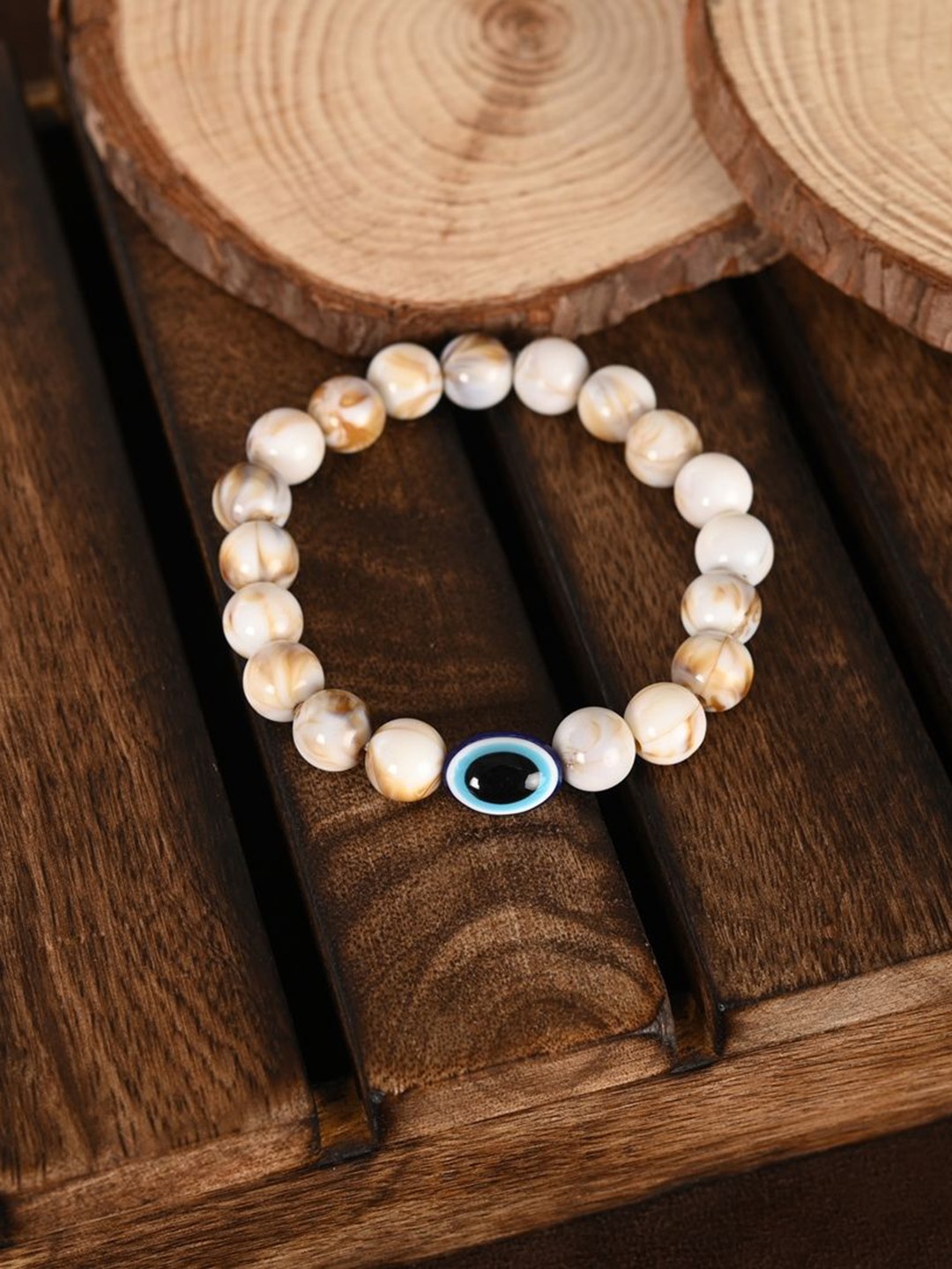 

NVR Evil Eye Beaded Elasticated Rakhi With Roli Chawal, Cream