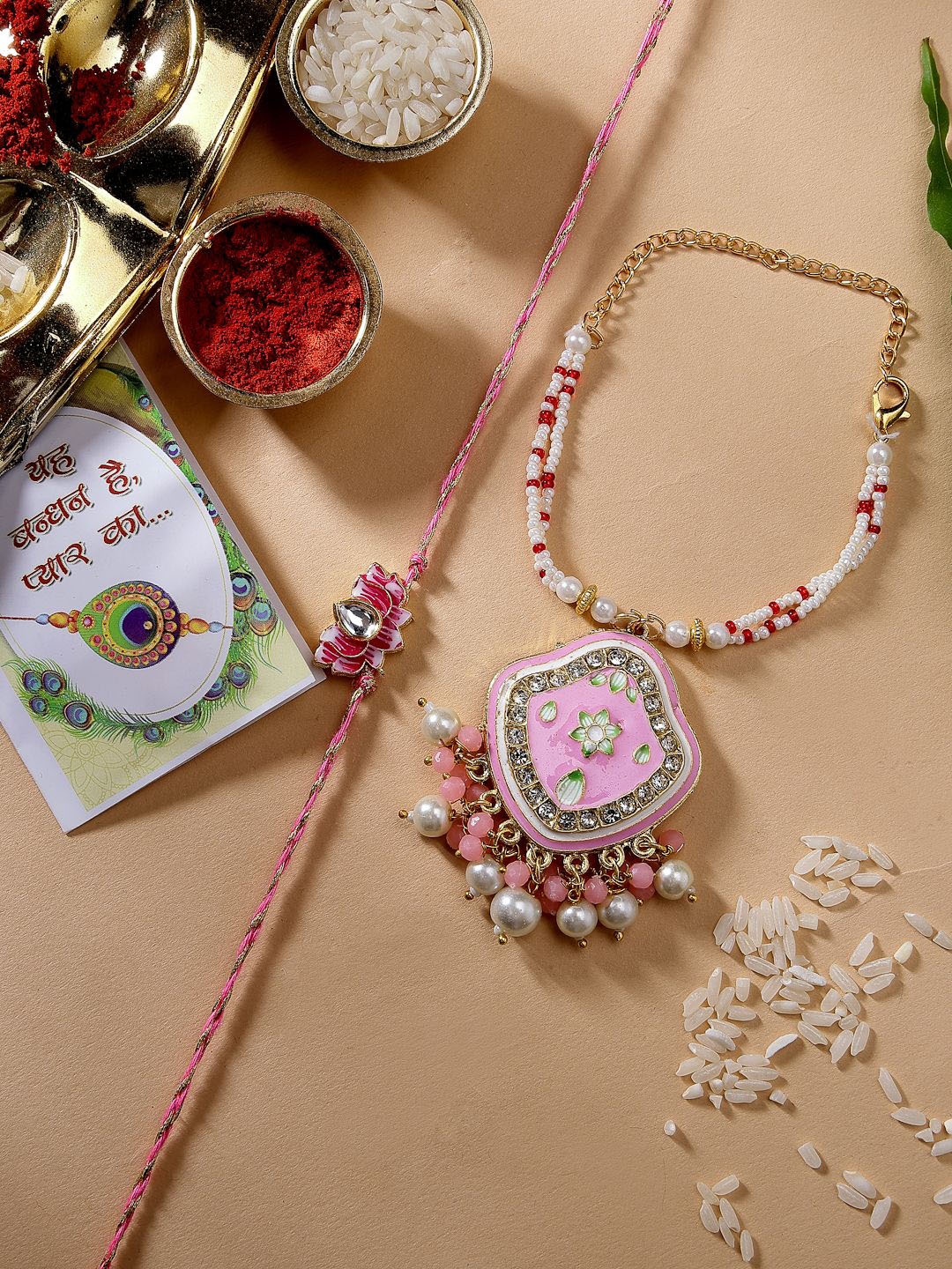 

NVR Set of 2 Kundan-Studded Wraparound Rakhis with Roli Chawal & Chocolate, Pink
