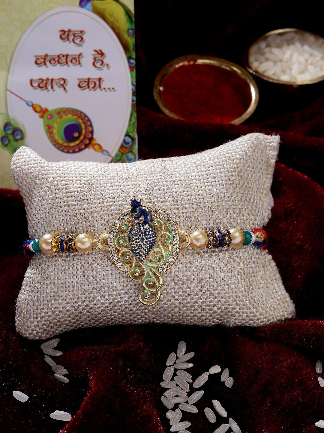 

NVR Set of 2 Peacock Design Stone-Studdded Rakhis with Roli Chawal & Chocolate, Blue