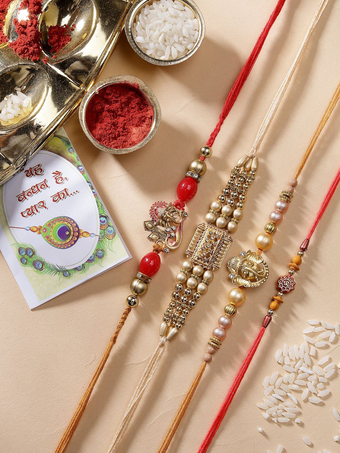 

NVR Set of 4 Stone-Studded Ganesh Rakhi With Roli Chawal & Chocolate, Red