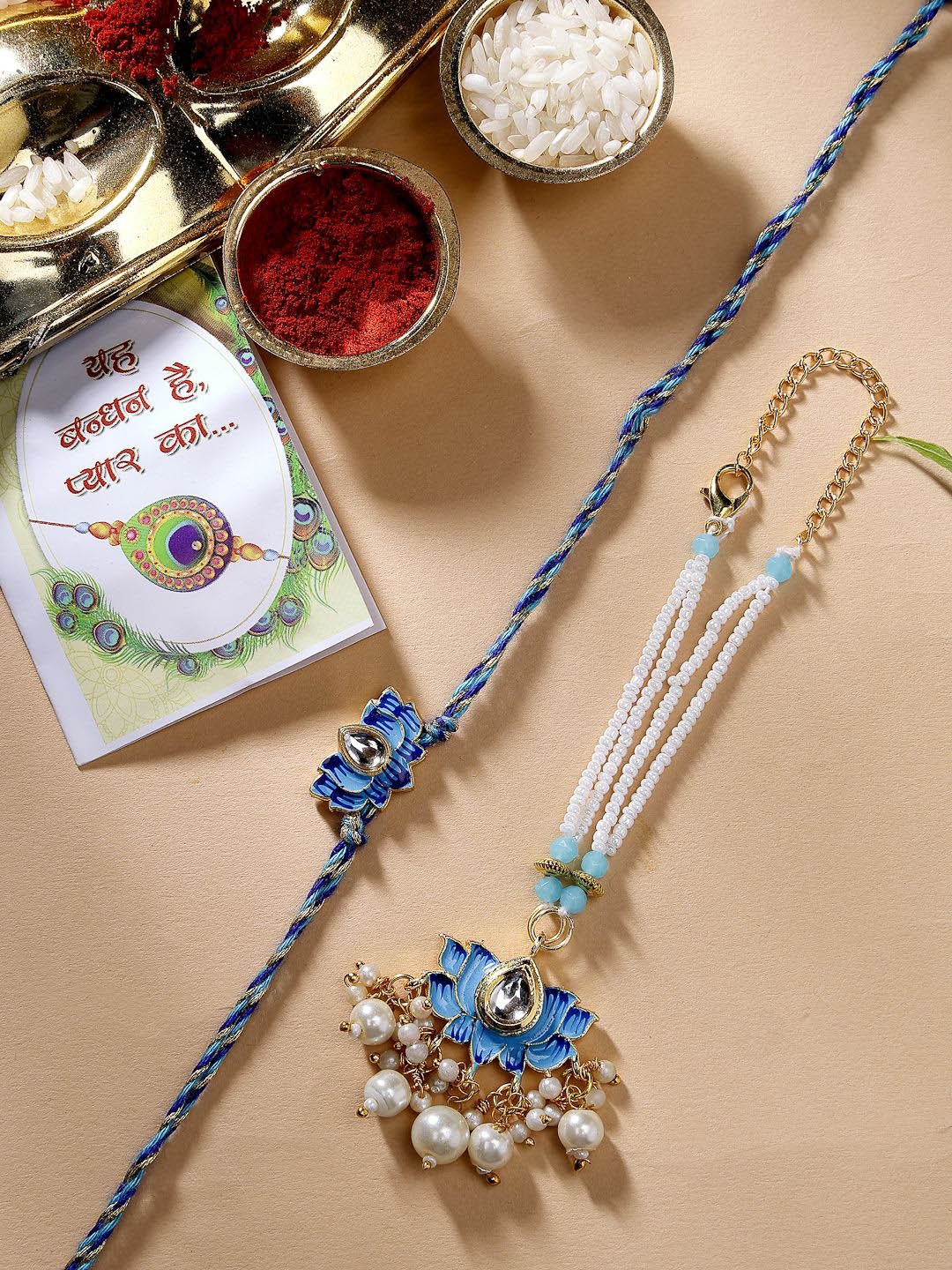 

NVR Kundan Studded Rakhis With Chocolate & Roli Chawal, Gold