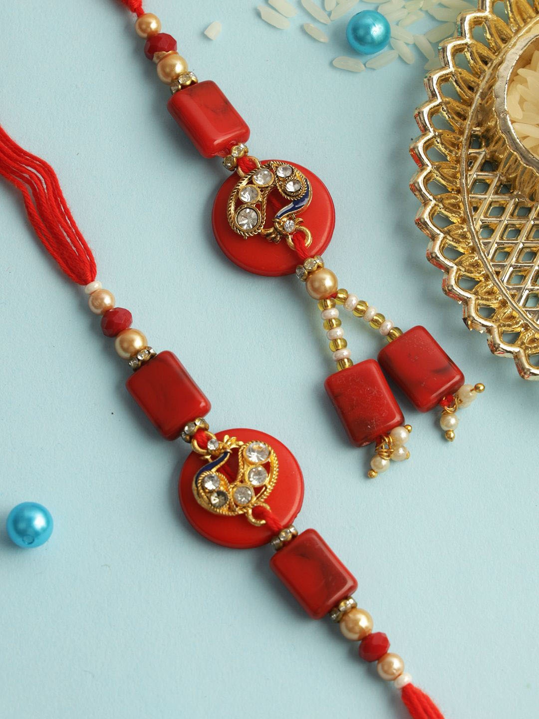 

Aapno Rajasthan Peacock Stone Work Bhaiya Bhabhi Rakhi with Roli Chawal & Greetings Card, Red