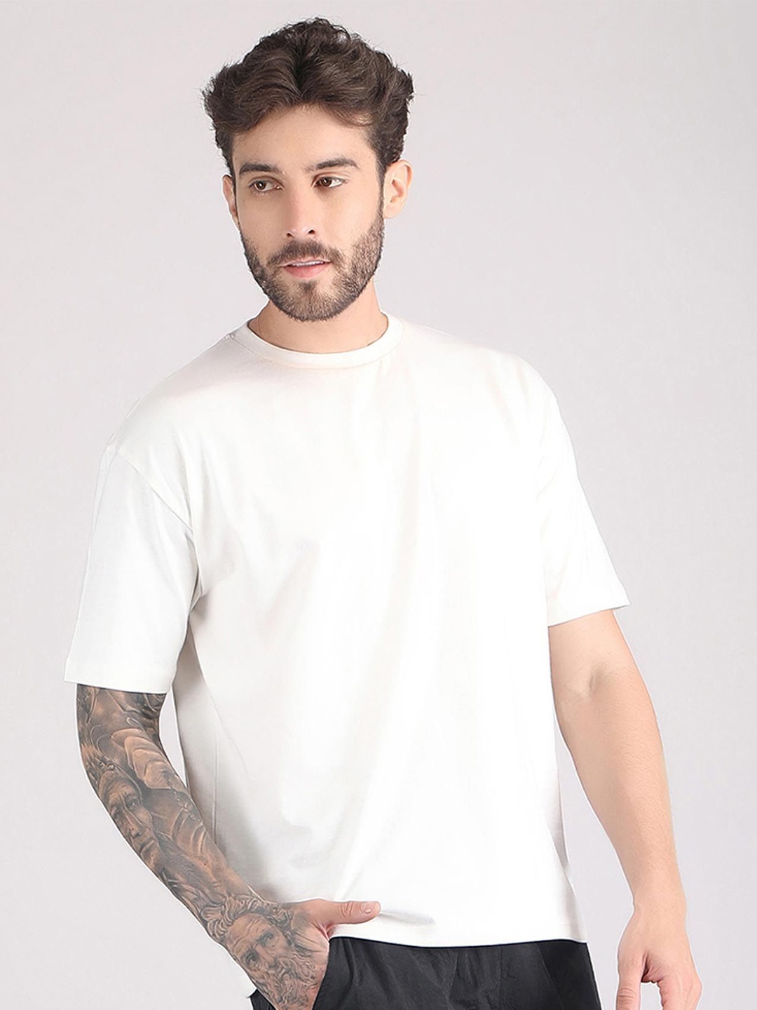

Raxedo Men Solid Round Neck T-shirt, Off white
