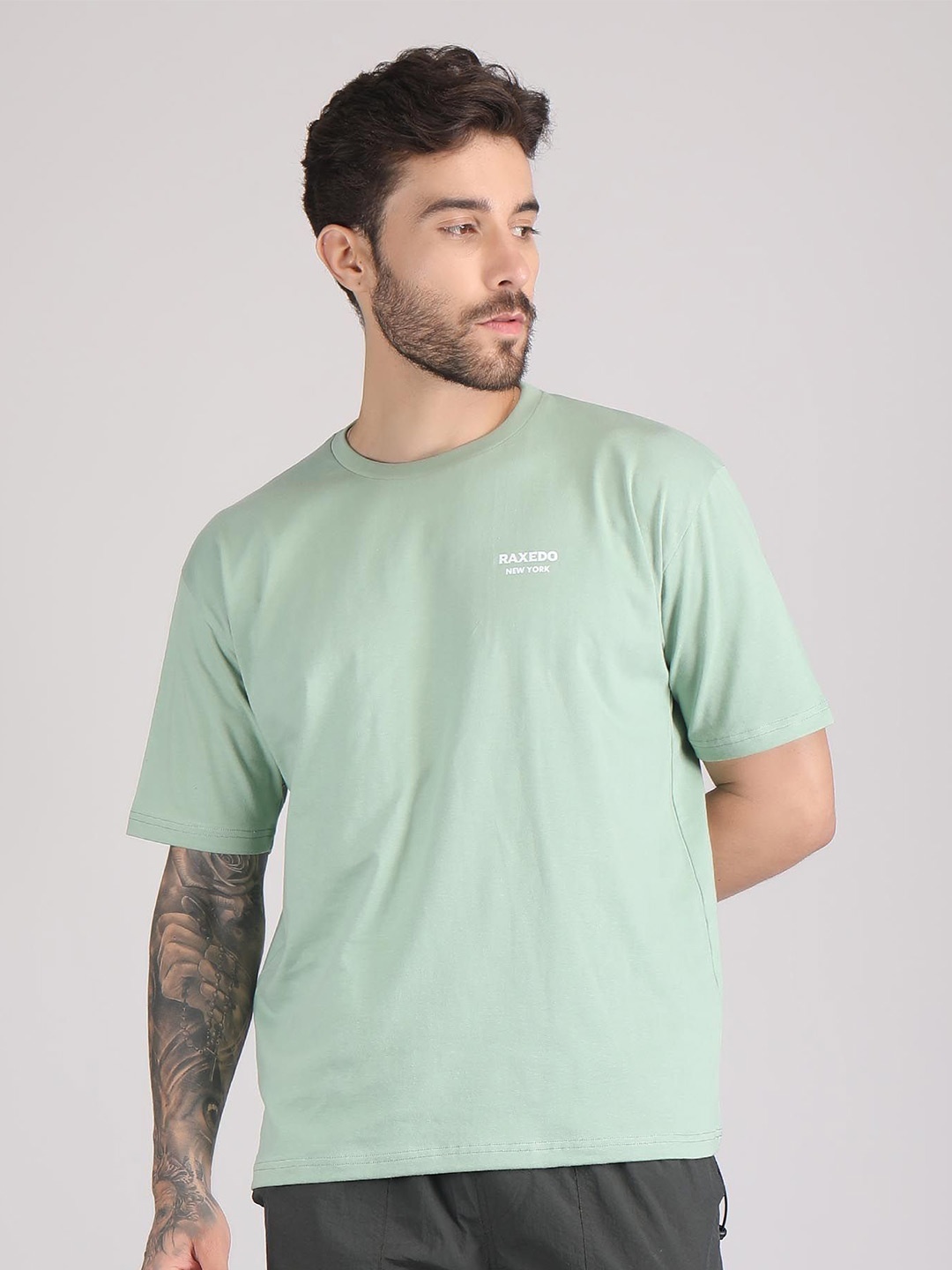 

Raxedo Men Solid Round Neck T Shirt, Green