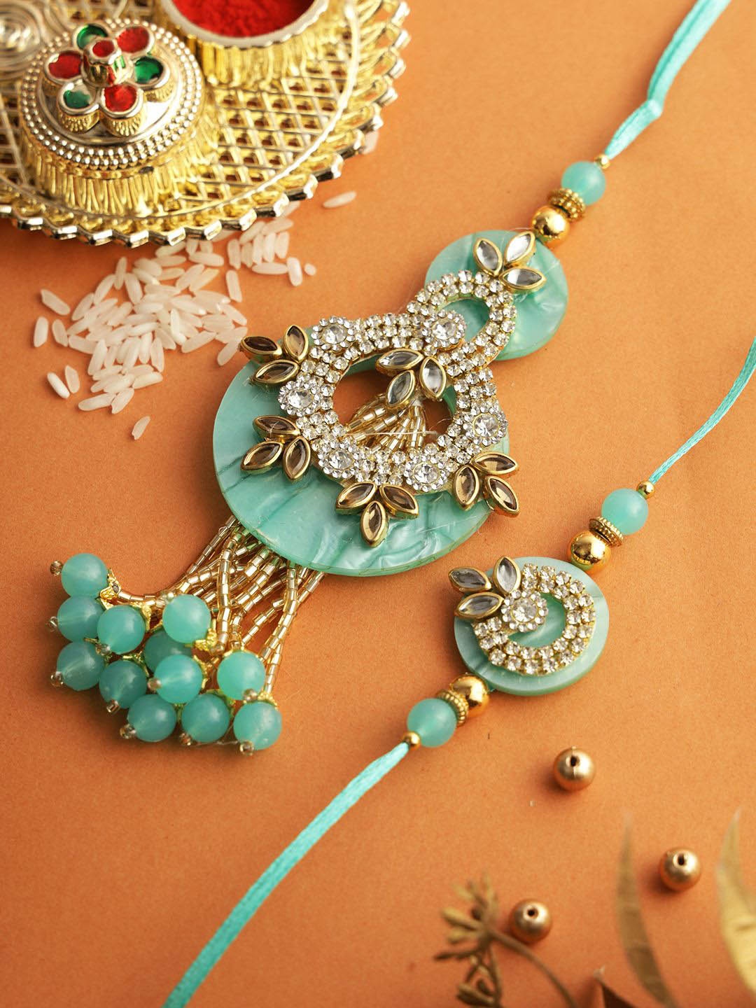 

Aapno Rajasthan Set of 2 Stone-Studs Bhaiya Bhabhi Rakhi with Roli Chawal & Greeting Card, Green
