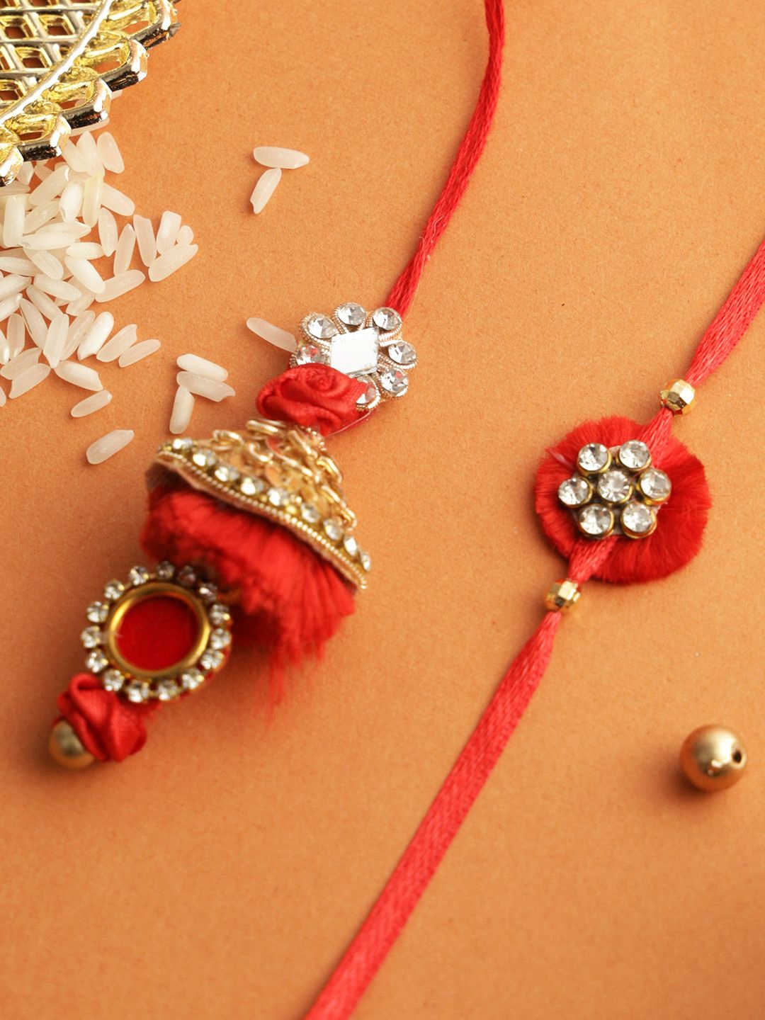 

Aapno Rajasthan Kundan Bhaiya Bhabhi Rakhi with Roli Chawal & Greetings Card, Red