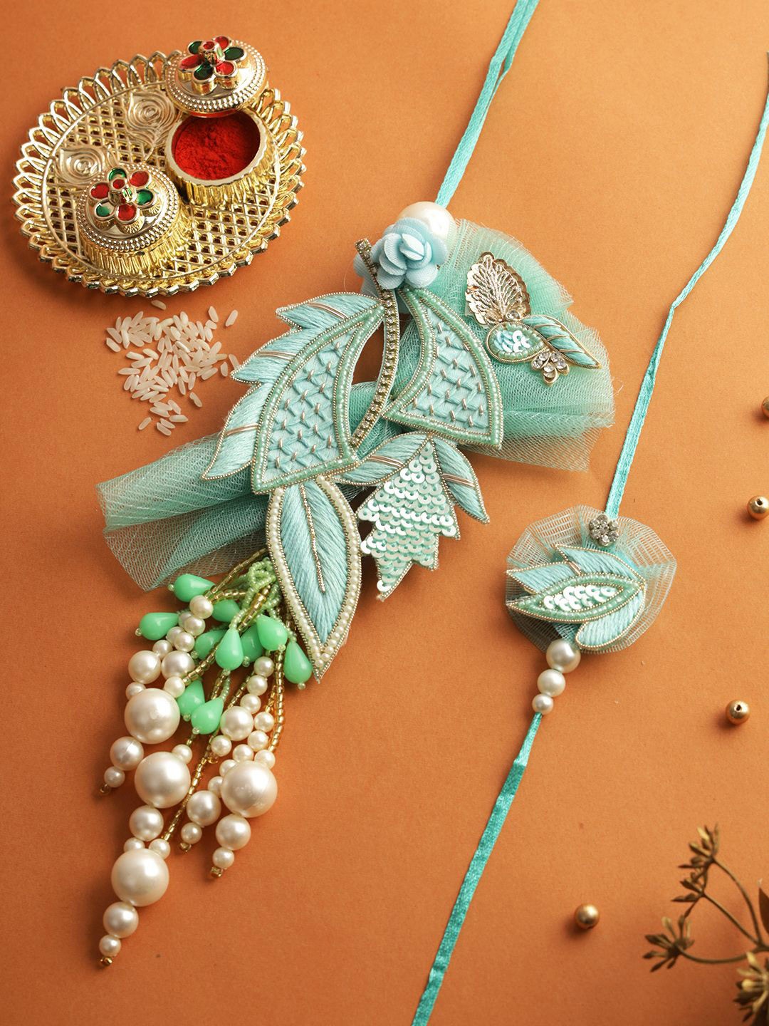 

Aapno Rajasthan Set of 2 Beaded Bhaiya Bhabhi Rakhi with Roli Chawal & Greeting Card, Blue