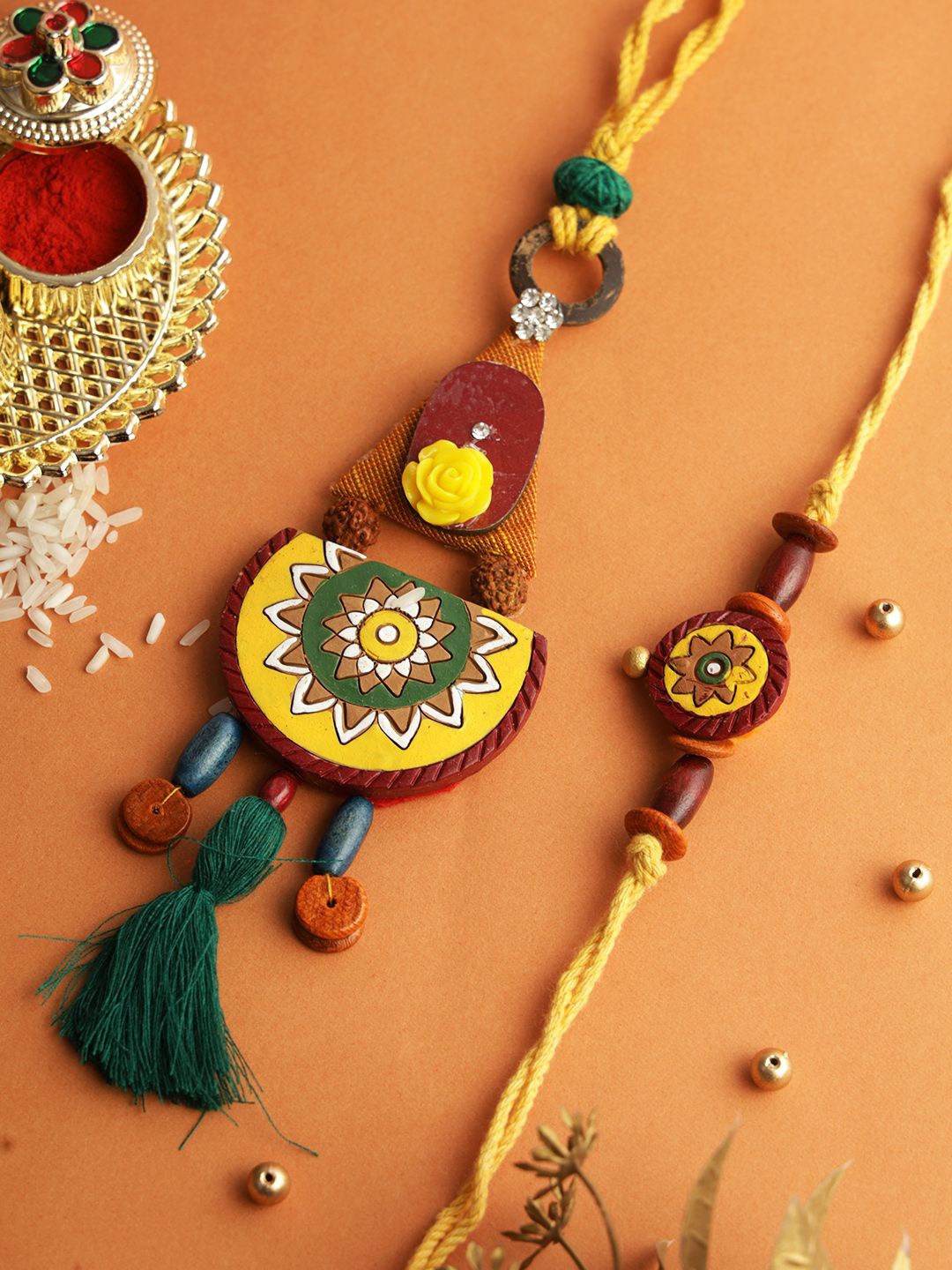 

Aapno Rajasthan Traditional Artistry Bhaiya Bhabhi Rakhi With Roli Chawal & Greetings Card, Brown