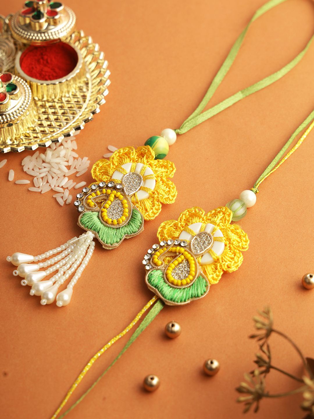 

Aapno Rajasthan Set of 2 Floral Bhaiya Bhabhi Rakhi with Roli Chawal & Greeting Card, Yellow