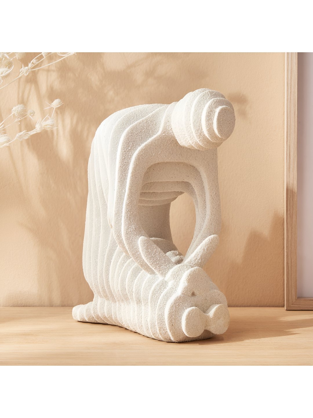 

Home Centre Off White Figurine Showpiece