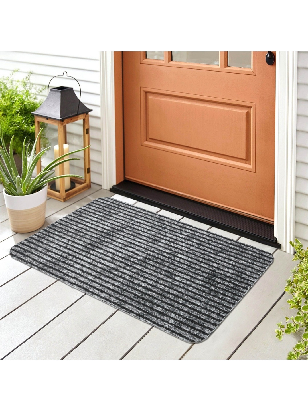 

Home Centre Black Self-Design Rectangular Doormats