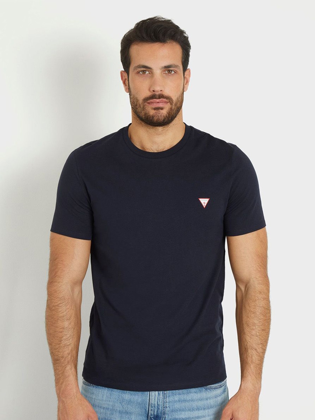 

GUESS Men Solid Round Neck T-shirt, Blue