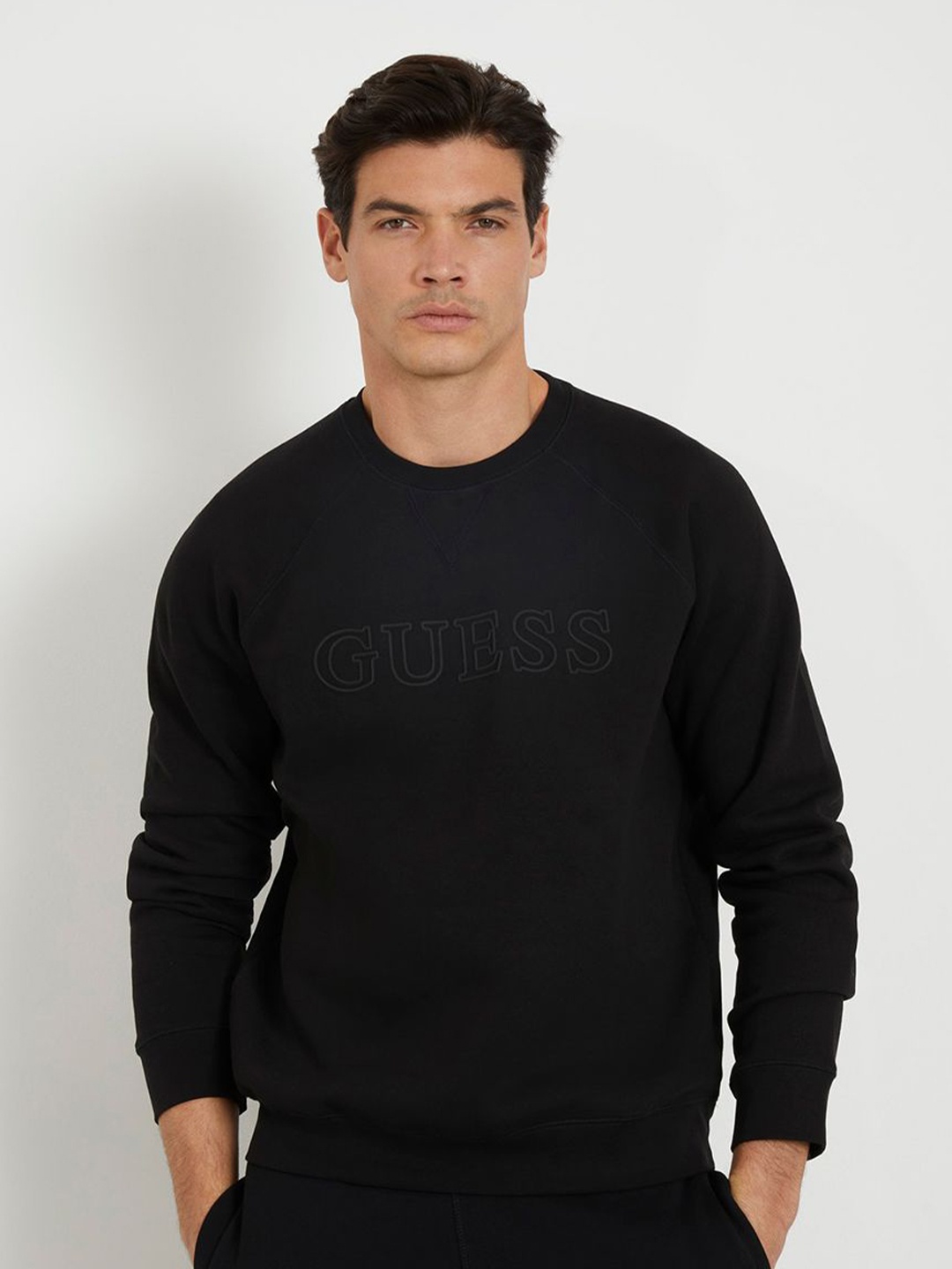 

GUESS Men Solid Brand Logo Round Neck Sweatshirt, Black