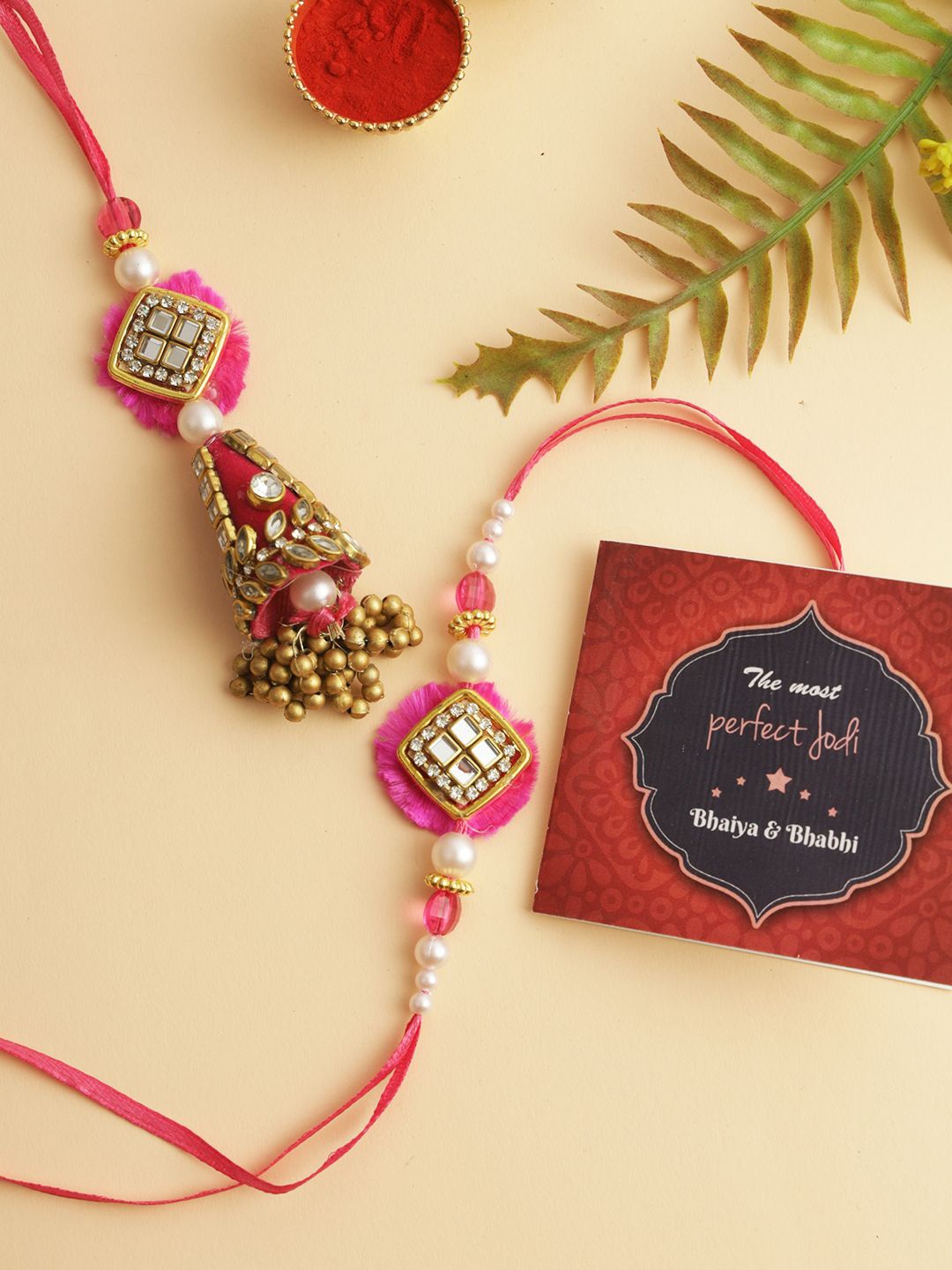 

TIED RIBBONS Set of 2 Rakhi for Bhaiya Bhabhi, Card and Roli Chawal Combo, Gold