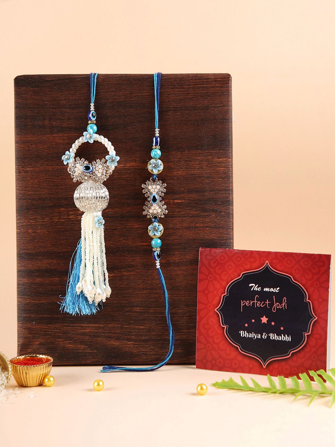 

TIED RIBBONS Set of 2 Evil Eye Rakhi for Bhaiya Bhabhi with Card and Roli Chawal, Blue