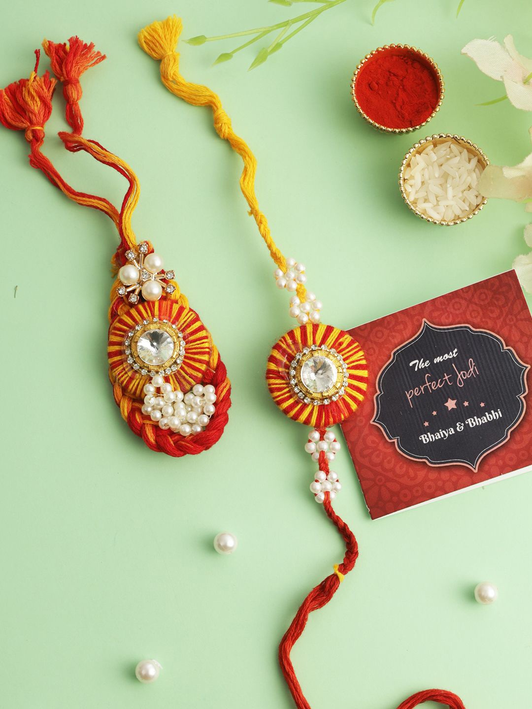 

TIED RIBBONS Set of 2 Bhaiya Bhabhi Rakhi with Card and Roli Chawal Gift, Gold