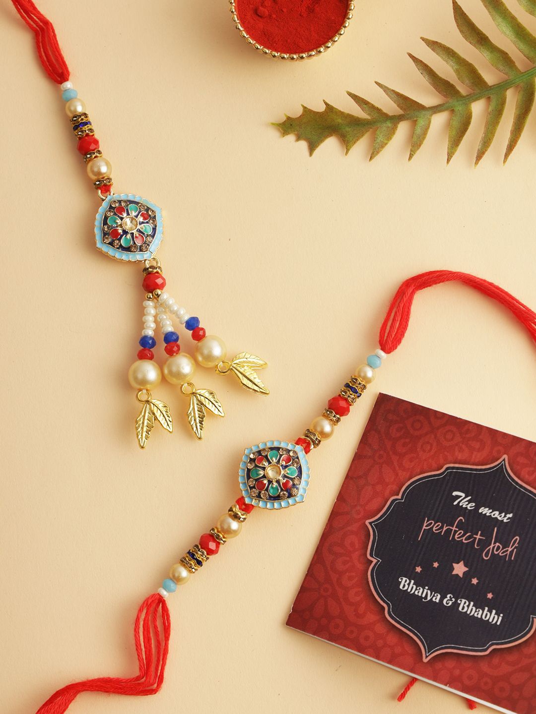 

TIED RIBBONS Set of 2 Bhaiya Bhabhi Rakhi, Card and Roli Chawal Pack, Red