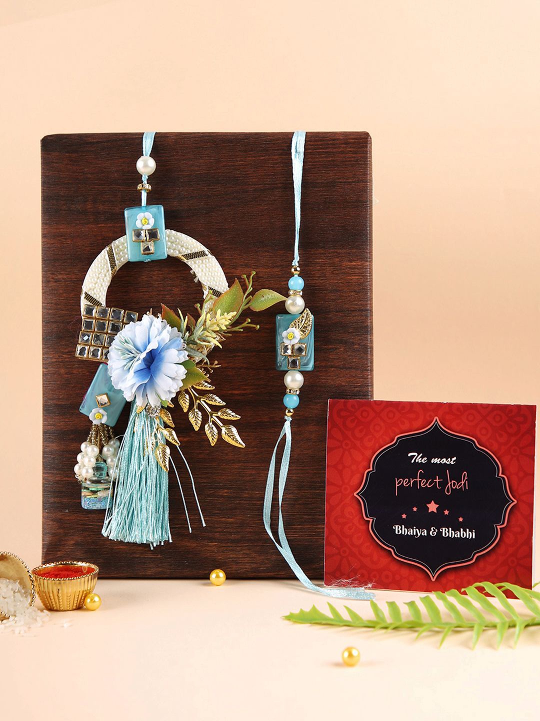 

TIED RIBBONS Set of 2 Floral Bhaiya Bhabhi Rakhi, Card and Roli Chawal Combo, Blue