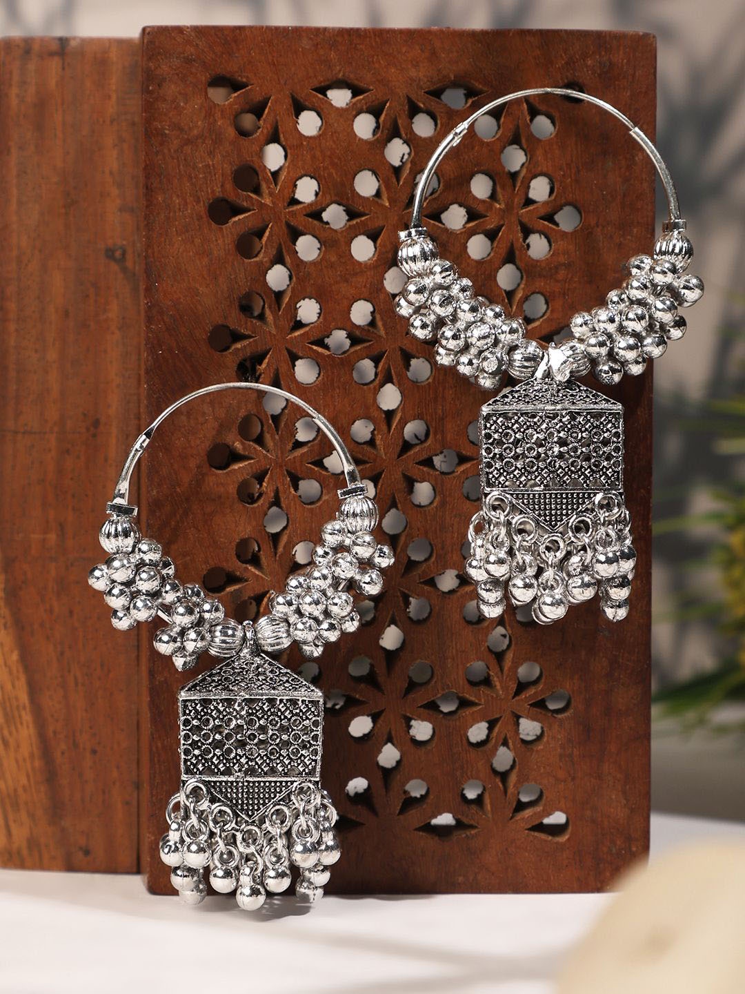 

ANIKAS CREATION Silver-Plated Dome Shaped Jhumkas