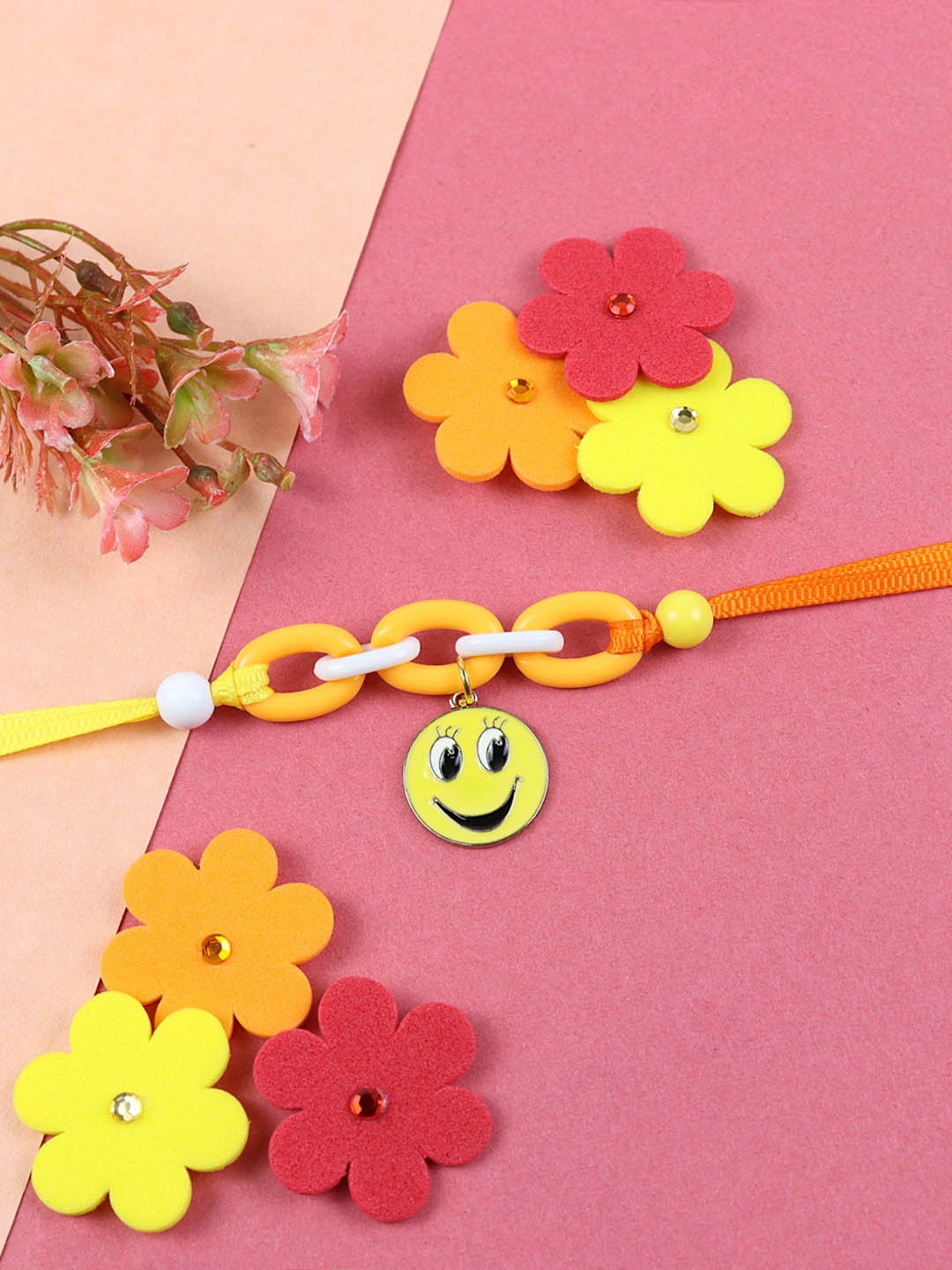 

Asthetika Smiley Hanging Charm Thread Rakhi With Roli Chawal, Yellow