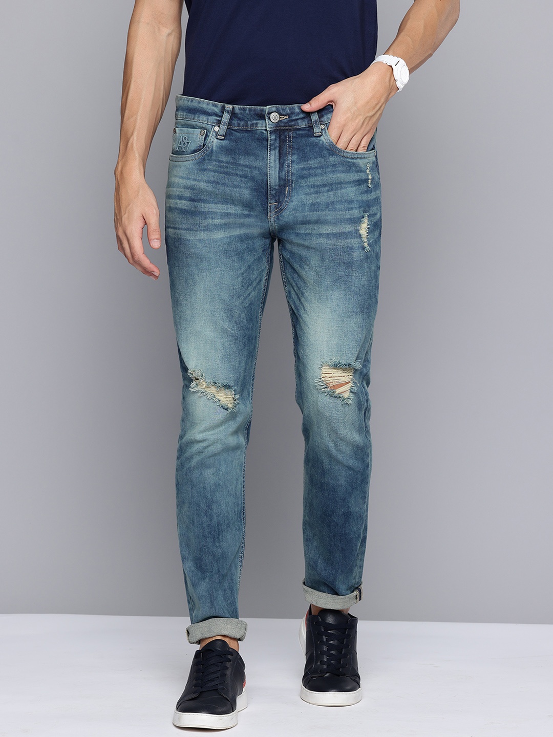

Aeropostale Men Tapered Fit Mildly Distressed Light Fade Stretchable Jeans, Blue